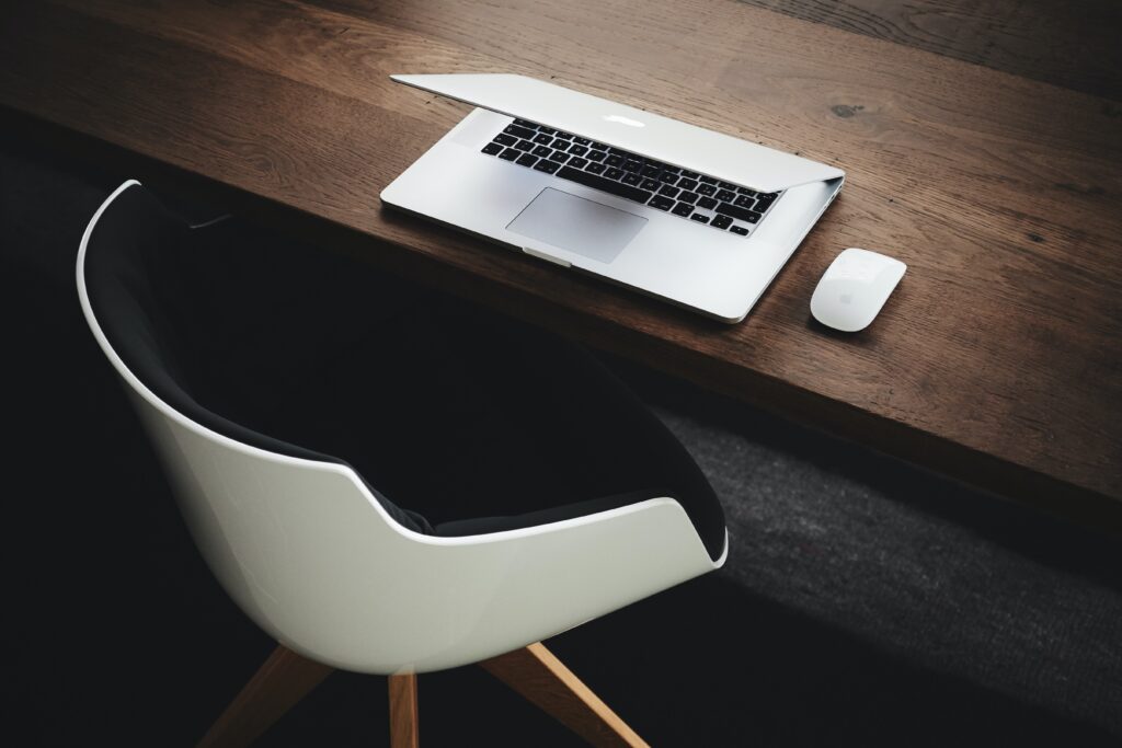 What is the importance of having a website for your business? computer chair with laptop
