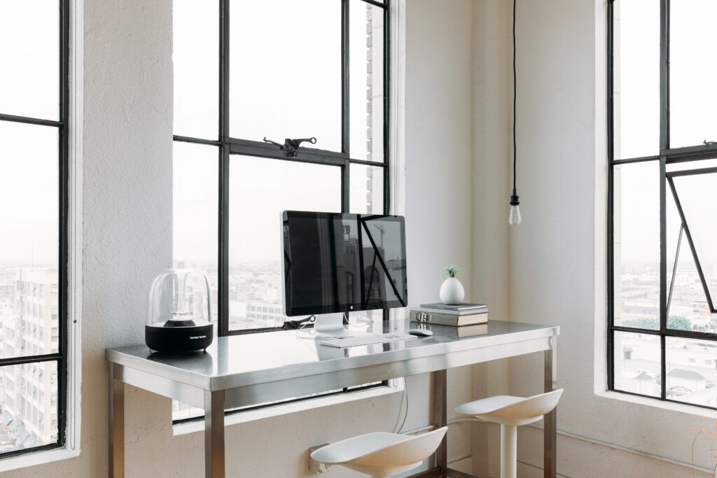 computer sitting on desk with chairs- is showit good for seo- showit seo